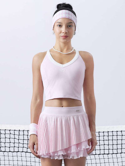 Pink cropped tank top with contrast trim, bow detail, and printed logo for a sleek, sporty look.