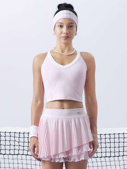 Pink cropped tank top with contrast trim, bow detail, and printed logo for a sleek, sporty look.