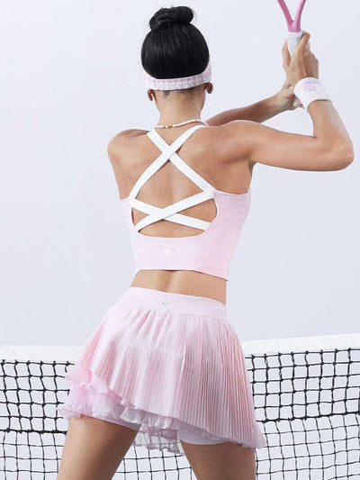 Pink cropped tank top with contrast trim, bow detail, and printed logo for a sleek, sporty look.