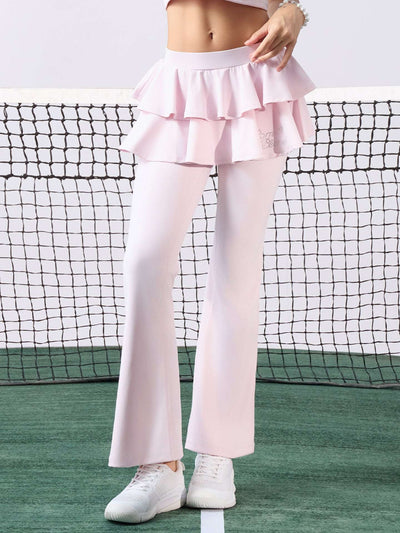 Pink flared tennis leggings with tiered-ruffle skirt, stretchy and breathable, easy movement from court to street.
