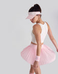 Side-back angle highlighting skirt’s flare and lightweight fabric, paired with a pink checkered visor