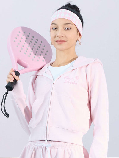 Soft pink zip-up hoodie with bow detail on the hood and embroidered logo, perfect for warm-ups or everyday wear.
