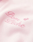Soft pink zip-up hoodie with bow detail on the hood and embroidered logo, perfect for warm-ups or everyday wear.