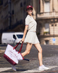 Side look white cropped polo with tennis skirt showing relaxed silhouette