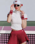 Model wearing a white summer tennis polo shirt outdoors