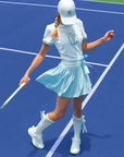 White knee-high tennis socks with sky blue stripes, bow detail, and logo embroidery.