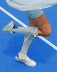 White knee-high tennis socks with sky blue stripes, bow detail, and logo embroidery.