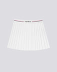 The white pleated tennis skirt is displayed clearly to highlight its classic athletic structure and fit.
