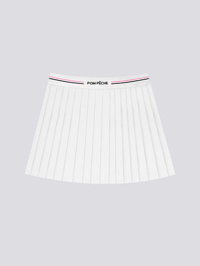 The white pleated tennis skirt is displayed clearly to highlight its classic athletic structure and fit.