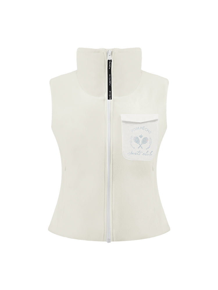 Warm white fleece vest with high-neck zip design and embroidered chest pocket, styled on the tennis court.