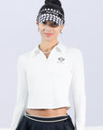 White long-sleeve zip-collar polo top with a subtle printed logo, featuring a fitted silhouette for a sleek, sporty look.