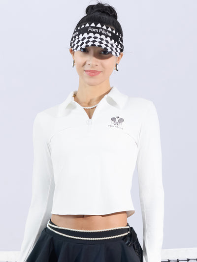 White long-sleeve zip-collar polo top with a subtle printed logo, featuring a fitted silhouette for a sleek, sporty look.