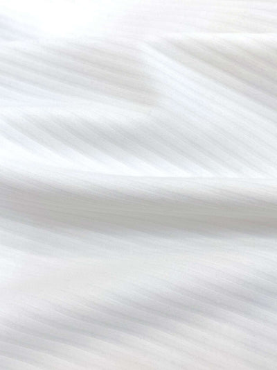 White long-sleeve zip-collar polo top with a subtle printed logo, featuring a fitted silhouette for a sleek, sporty look.