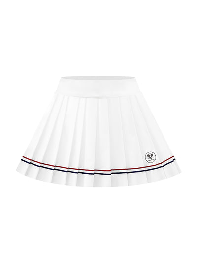 Minimalist shot of white pleated skirt with double stripes, styled with white sneakers and a natural pose