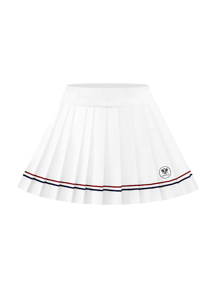 Minimalist shot of white pleated skirt with double stripes, styled with white sneakers and a natural pose