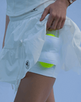 White ruffle tennis skirt with bow details, a soft layered look and airy movement.