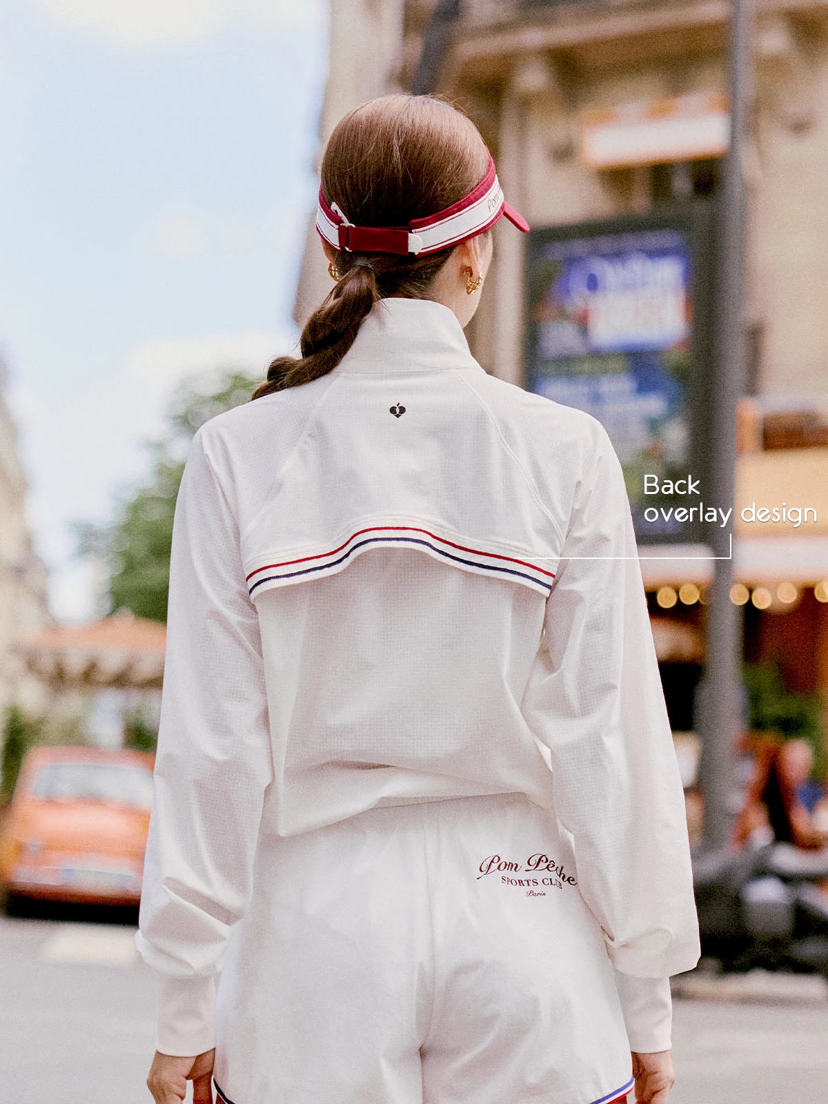 Poise™ White UPF Sun Jacket, back view of minimalist sporty jacket on model
