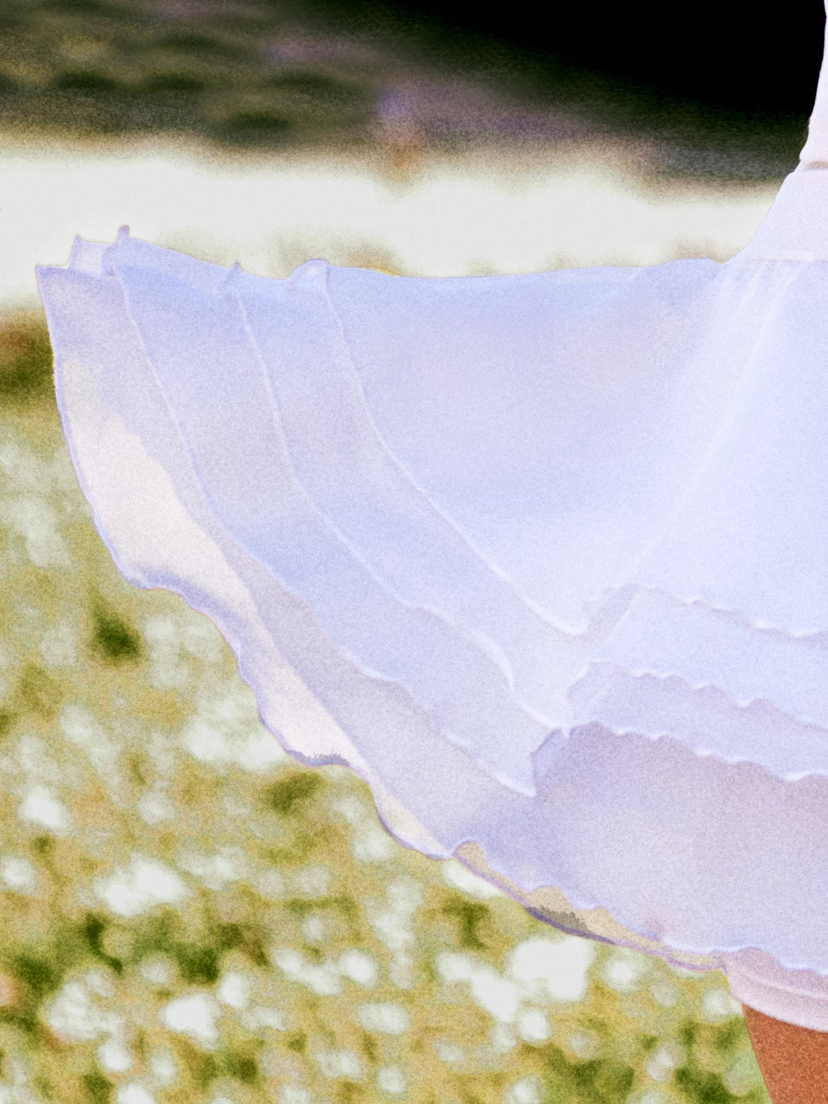 The White Spin™ rose petal dress features a four-layer mesh design, making it lightweight and flowy.