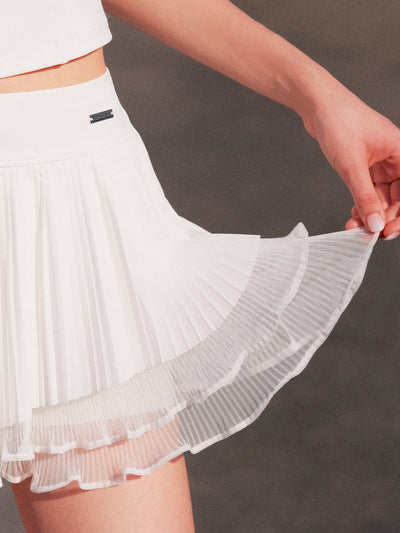 close-up of layered pleated ruffle hem of White Spin™ Waltz Skirt