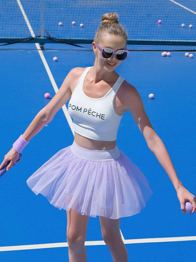 White sports bra with brand logo, designed for comfort and style during active sports.