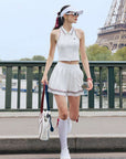 White zip-front tennis tank with red and blue contrast trims, perfect for court or city wear.