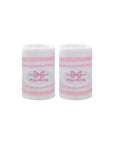 White tennis wristbands with soft pink stripes, featuring embroidered bow and logo details.