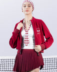 Deep red fleece zip-up jacket with a soft texture and subtle logo detail, offering a polished yet cozy look.