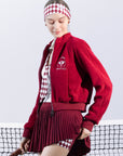 Deep red fleece zip-up jacket with a soft texture and subtle logo detail, offering a polished yet cozy look.