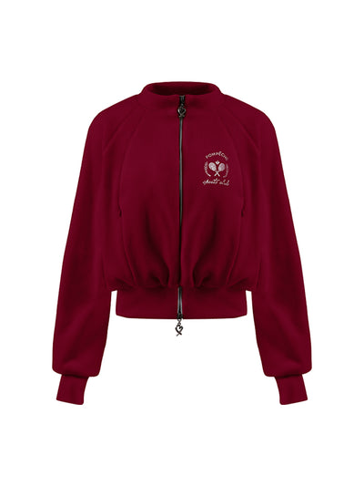 Deep red fleece zip-up jacket with a soft texture and subtle logo detail, offering a polished yet cozy look.