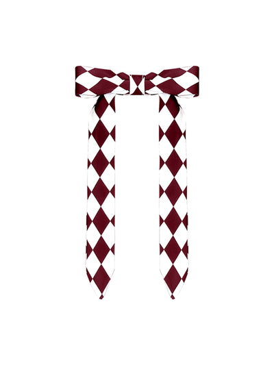 Wine red tennis cap with embroidered logo and adjustable ribbon on the back strap.