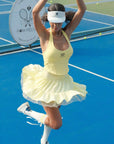 Woman playing tennis in layered ruffle tennis skirt