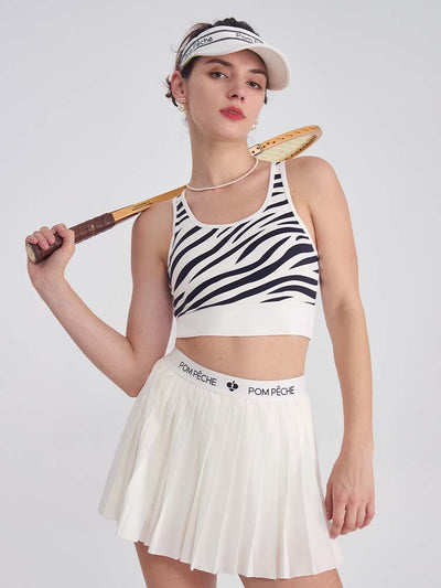 White sports bra with printed zebra pattern, designed for comfort and style during active sports.