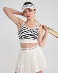 White sports bra with printed zebra pattern, designed for comfort and style during active sports.