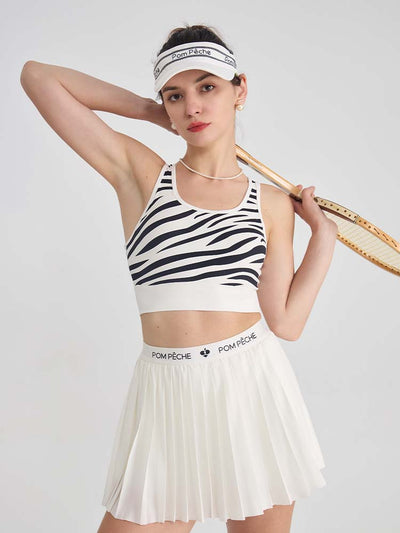 White sports bra with printed zebra pattern, designed for comfort and style during active sports.
