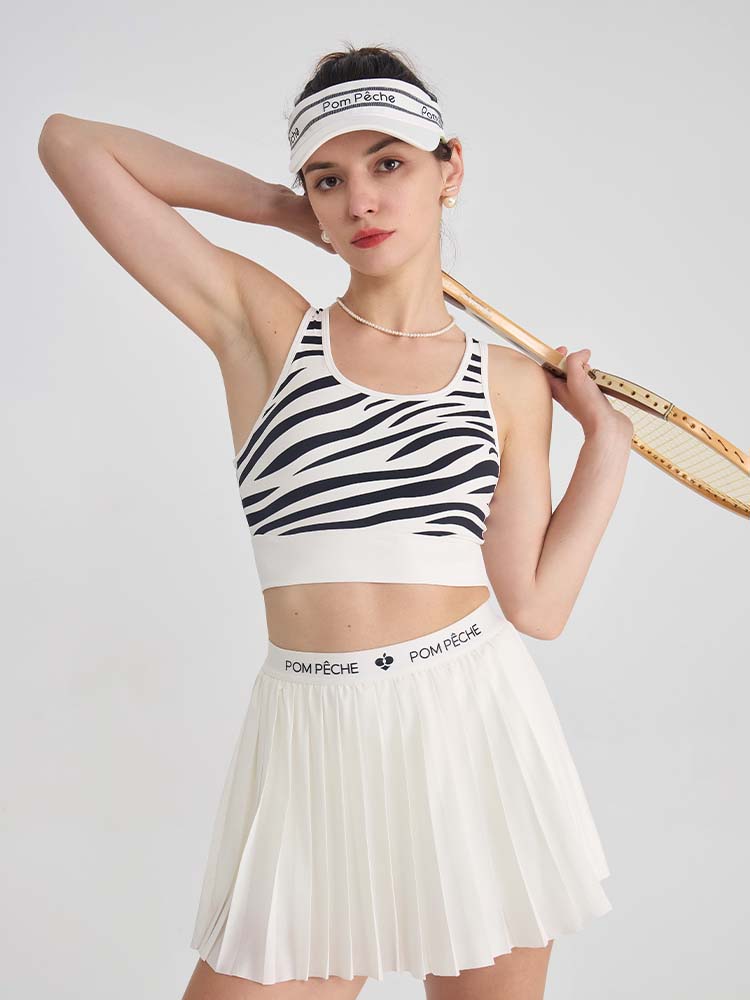 White sports bra with printed zebra pattern, designed for comfort and style during active sports.
