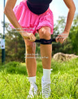 Adjustable Patella Support Strap detail, featuring ergonomic curved design and integrated silicone padding for targeted knee support and stability