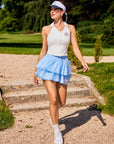 Betty Boop Cake Skirt in Paris Blue, tiered ruffle tennis skort with lightweight polka dot mesh, built-in shorts, and playful feminine design