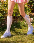 Side view of knee-high bow socks with 35cm length and stay-up design
