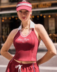 Checkered Cooling Tennis Visor in red by Pom Pêche, front view, worn with matching red sport set, street lifestyle