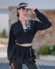 Cropped UV tennis jacket with waist cinch in black, women’s lightweight sporty jacket front view