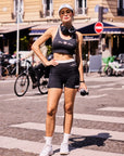 High Slit Contrast Active Shorts Navy lifestyle outfit, showcasing women's activewear styling, sporty look, built-in liner, and versatile training to casual wear