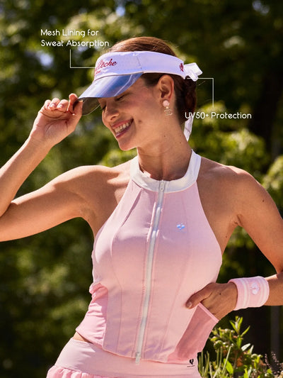 La Rose Ruffle Performance Visor White detail, featuring signature rose embroidery, breathable perforated forehead zone, and lightweight UV protective design