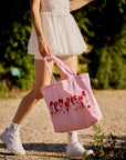 Oversized Court Tote Bag, women's canvas tennis bag with racquet storage, spacious design, and French-inspired pink illustration