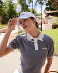 Model wearing Paris Racquet Club cap front view with structured fit