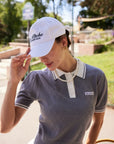Cap side view with curved brim and soft lightweight crown