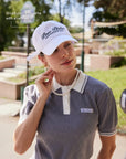 Close up of soft lightweight crown and classic curved brim on Paris Racquet Club cap