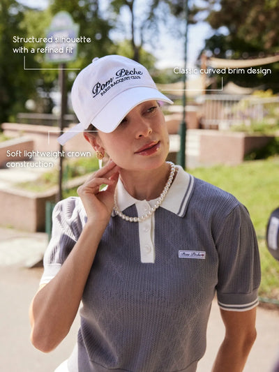 Close up of soft lightweight crown and classic curved brim on Paris Racquet Club cap