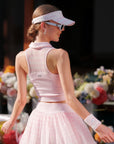 Poise™ pink half-zip polo worn by model back view, featuring Poise™ premium back yarn that resists cling when sweaty.