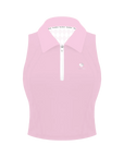 Poise™ pink half-zip polo on white background, front view showing cropped length, defined shoulder, and semi-zipped collar.