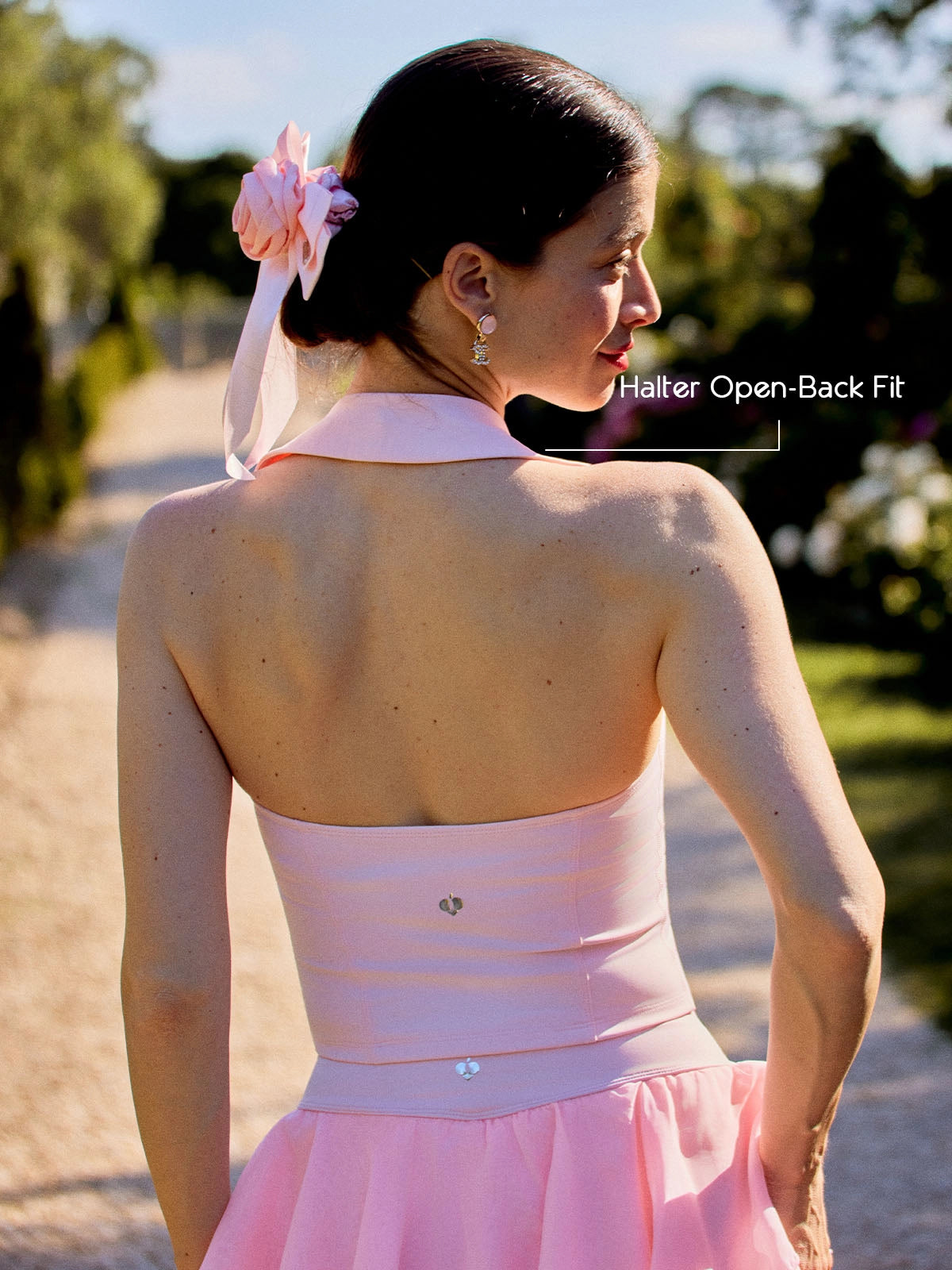 Poise Rose Halter Polo Tank Pink back view, showcasing halter-inspired open back design, breathable silhouette, and feminine rose embroidery detail